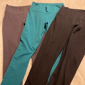 3 pairs of Fabletics Powerhold leggings.